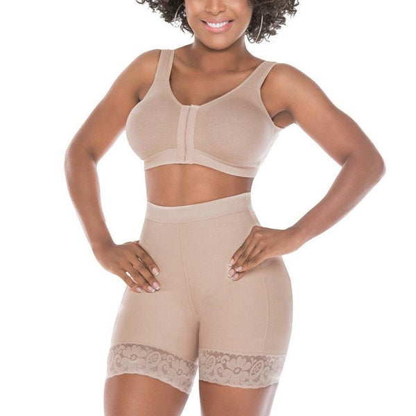 Stella's Corset beige high-compression Powernet butt lifter shorts with lace trim worn by a smiling model