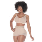 Woman wearing a beige shapewear set on a white background