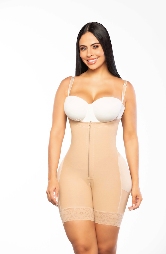 Woman wearing a beige shapewear garment on a white background