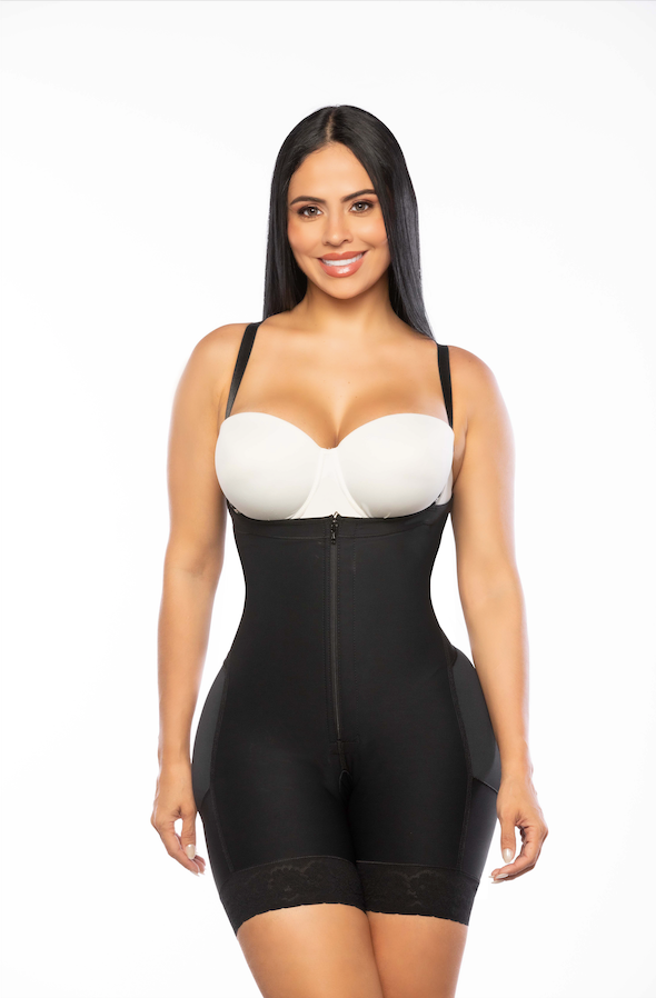 Woman wearing a black shapewear garment on a white background