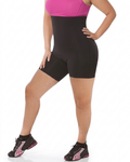 Person wearing black athletic shorts and pink top on a white background