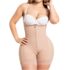 Woman wearing a beige shapewear garment on a white background