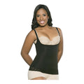 A woman with dark hair smiling while modeling a black open-bust compression tank top shapewear garment. The shapewear fits tightly around her torso, featuring thin adjustable straps and a lace border at the bottom hem. She is wearing it over a beige bra and matching boy-short underwear, set against a plain light gray background
