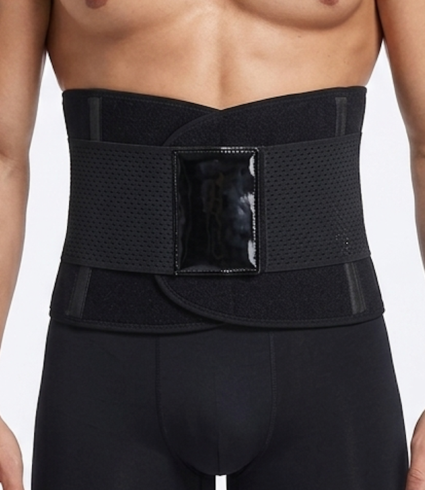 Black waist support belt worn by a person on a white background