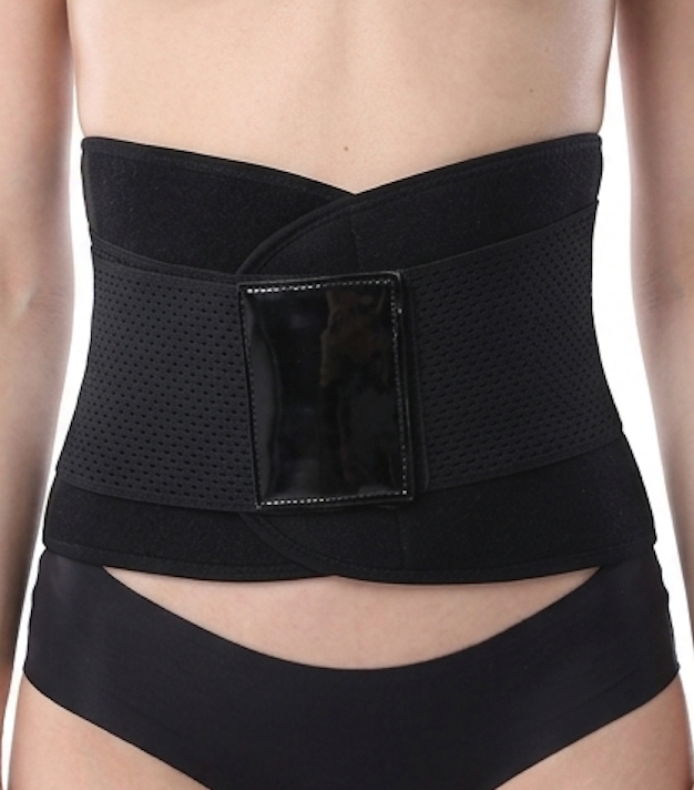 Black waist trainer worn by a person on a white background