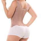 Person wearing a beige compression garment on a white background