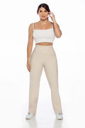 Stella's Corset beige athletic pants with a high waist, designed for performance and comfort. Moisture-wicking and flexible.