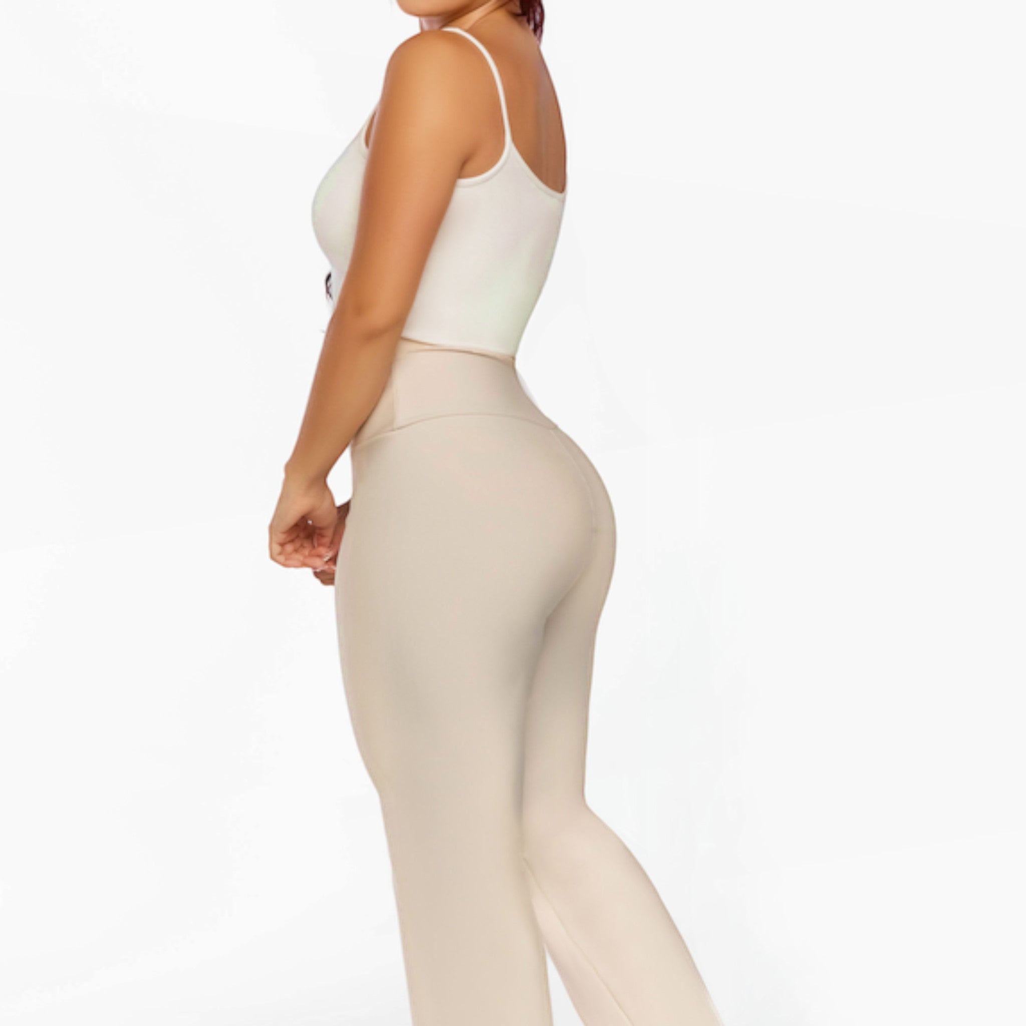 Stella's Corset beige athletic pants with a high waist and flared leg, designed for performance and comfort.