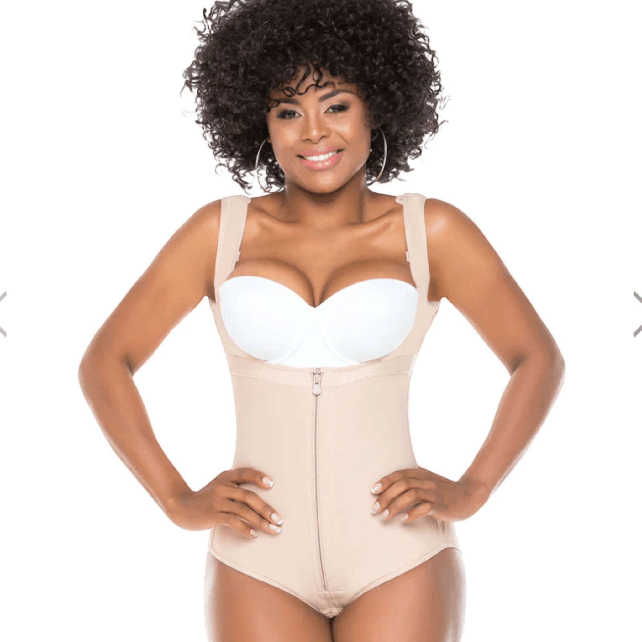 Stella's Corset beige powernet slimming body vest worn by a smiling woman with curly hair for seamless body shaping.