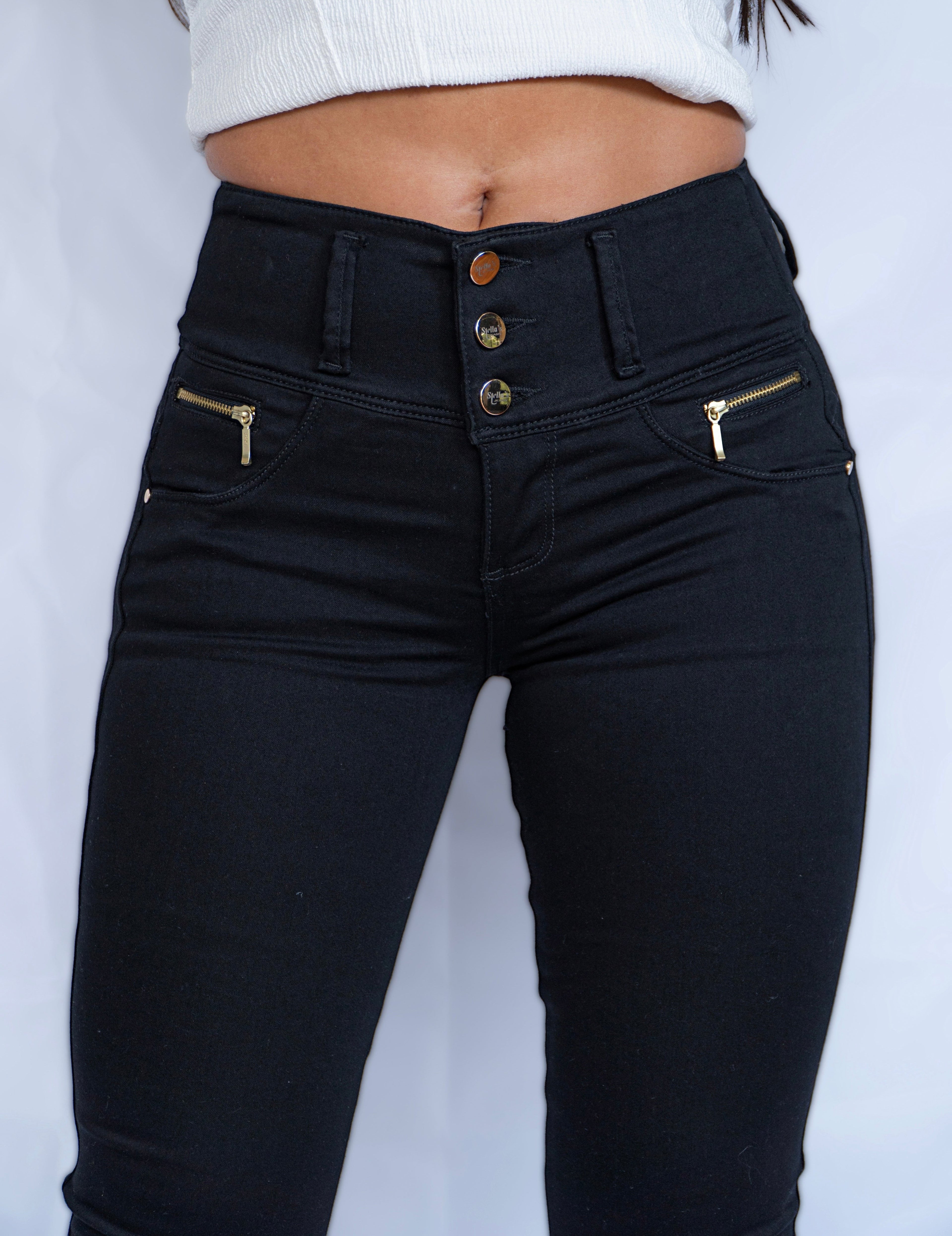 Stella's Corset black skinny butt-lifter jeans with gold zipper accents and no back pockets.