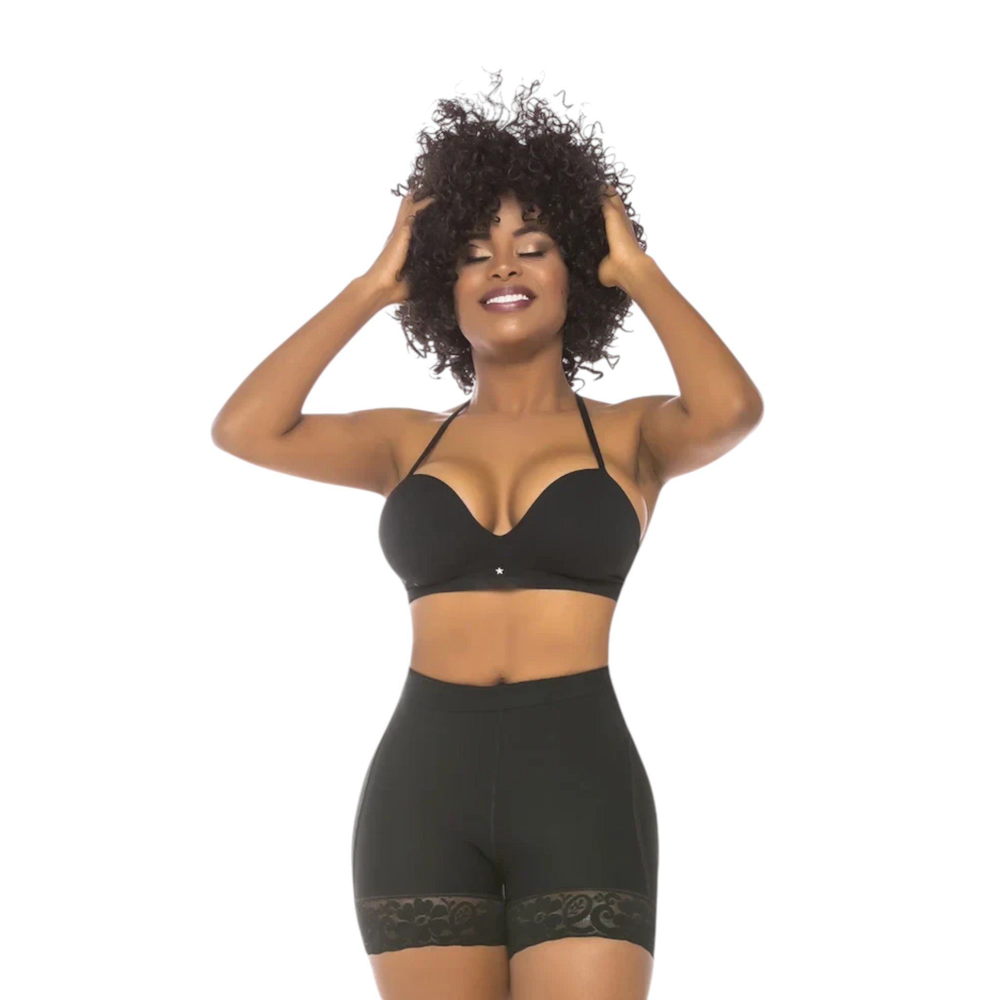 Stella's Corset high-compression black Powernet butt lifter shorts with lace trim worn by a smiling model.