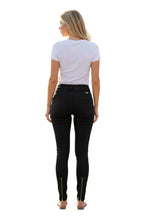 Stella's Corset black skinny butt-lifter jeans with front zipper accents and ankle zippers, no back pockets.