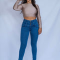 Stella's Corset blue denim high-waist butt lifter jeans with button fly and skinny flare leg.