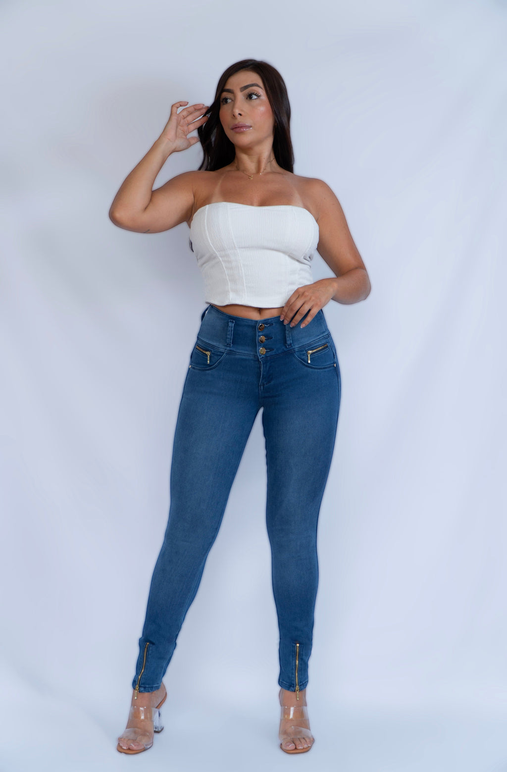 Stella's Corset blue denim skinny butt-lifter jeans with front zipper pockets and ankle zippers.