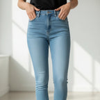 Stella's Corset light blue high-waisted skinny leg jeans with five-pocket styling and zip-fly closure.