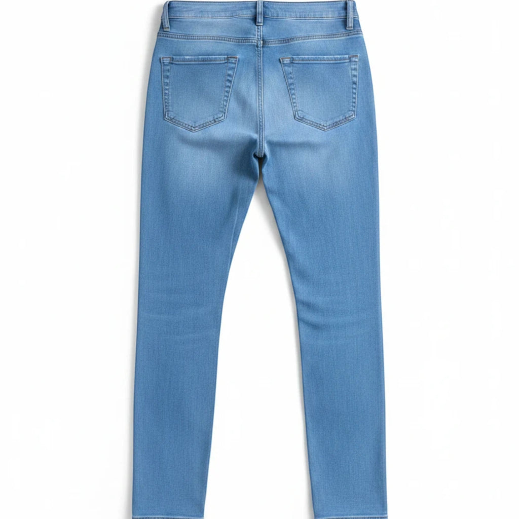Stella's Corset light blue high waisted skinny leg butt lifter jeans with five-pocket styling.