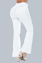 Stella's Corset white high-waisted butt lifter jeans with heart stitching and button detail on flared leg.